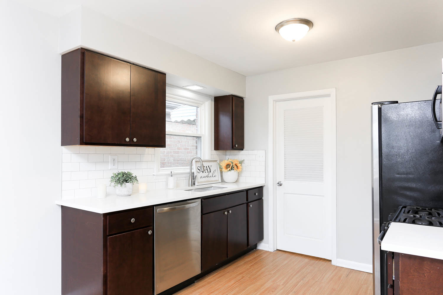 7736 State Road Burbank, IL 60459 - Photo 8 of 20 a bathroom with a double vanity sink and mirror