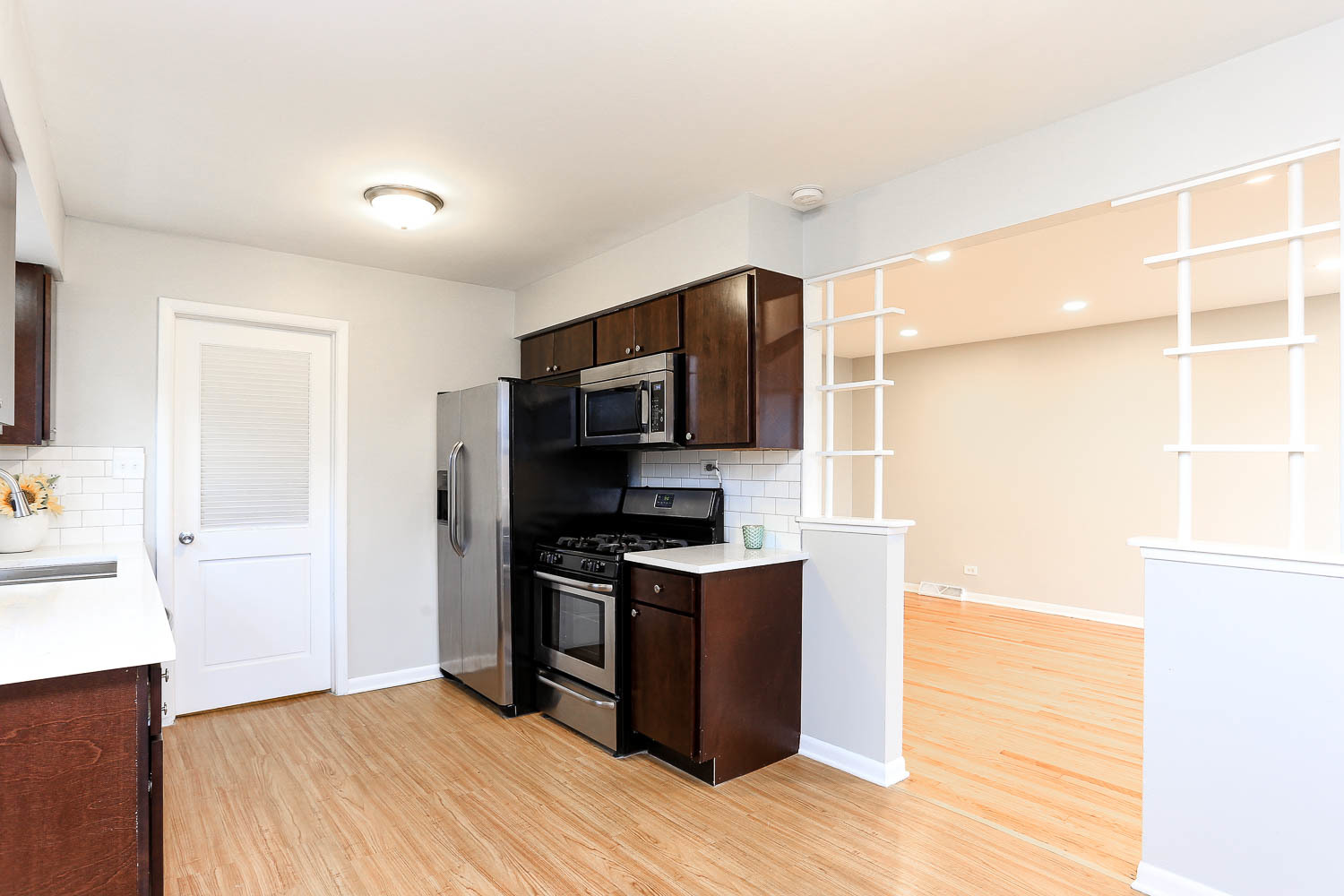 7736 State Road Burbank, IL 60459 - Photo 10 of 20 a kitchen with stainless steel appliances granite countertop a stove and a refrigerator