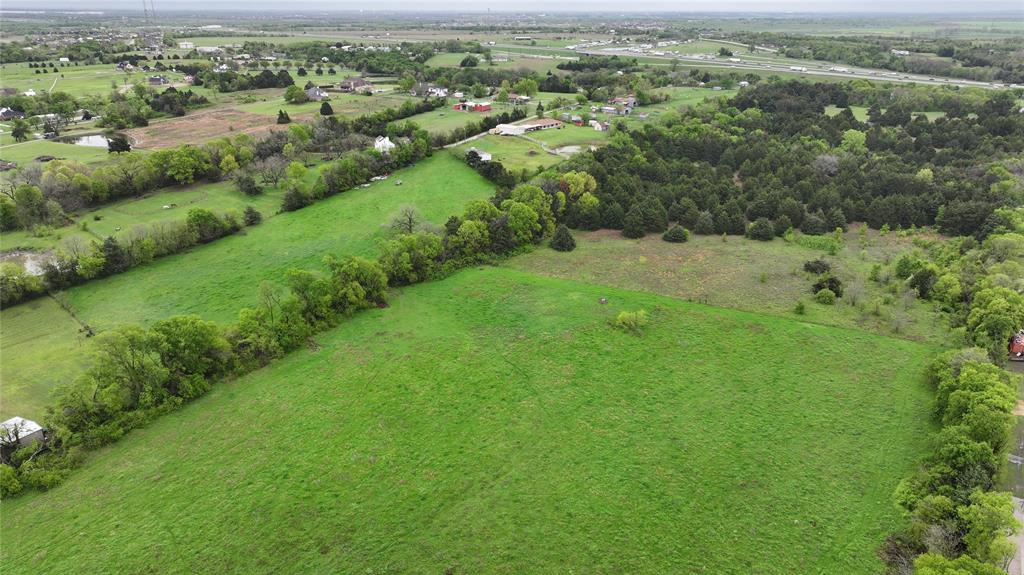 15530 Wiser Road Forney, TX 75126 - Photo 3 of 3 an aerial view of residential houses with outdoor space and trees