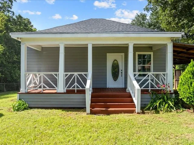a house view with a garden space