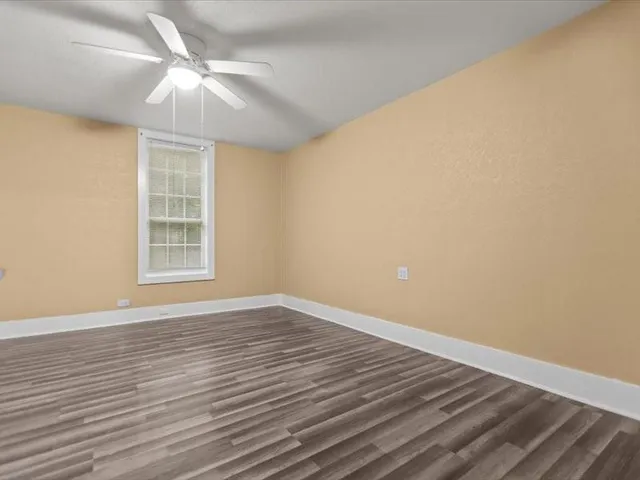 a view of a hallway with closet and utility room