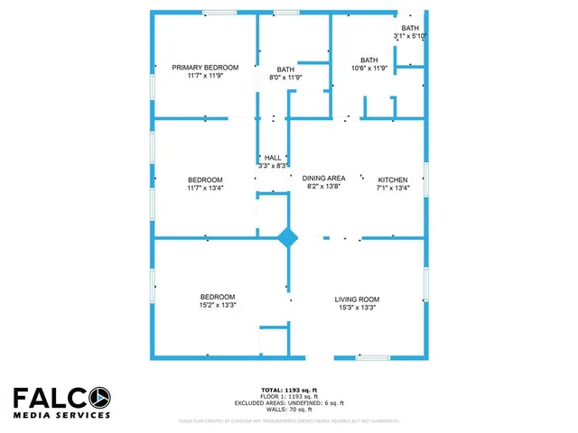 a view of an empty room with wooden floor and window