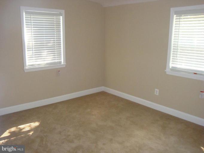 5749 Maplehill Road Baltimore, MD 21239 - Photo 14 of 15 an empty room with a window