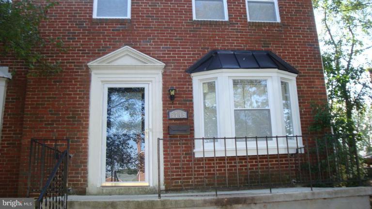5749 Maplehill Road Baltimore, MD 21239 - Photo 15 of 15 a front view of a house with a yard