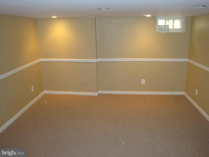 5749 Maplehill Road Baltimore, MD 21239 - Photo 9 of 15 a view of an empty room