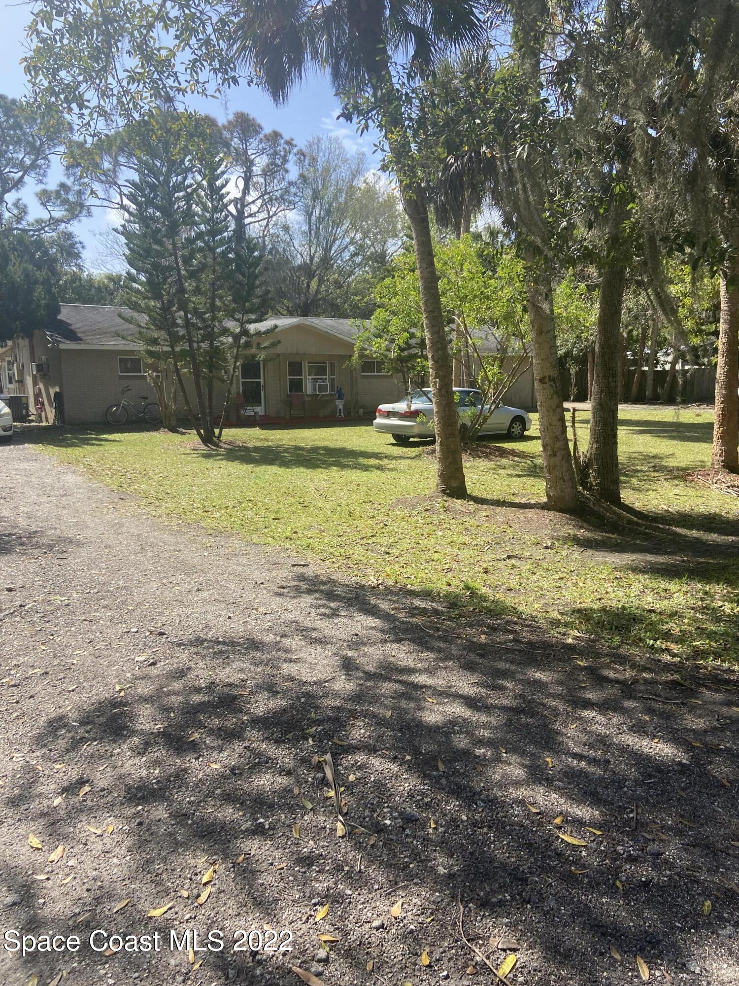 435 East Crisafulli Road Merritt Island, FL 32953 - Photo 1 of 6 a view of a yard with swimming pool