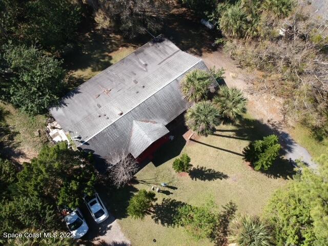 435 East Crisafulli Road Merritt Island, FL 32953 - Photo 6 of 6 an aerial view of a house with a yard