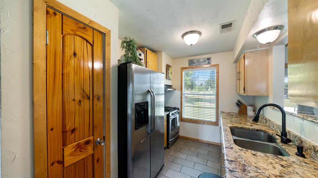 29080 Highway 19 Athens, TX 75752 - Photo 12 of 30 a kitchen with a refrigerator sink and cabinets