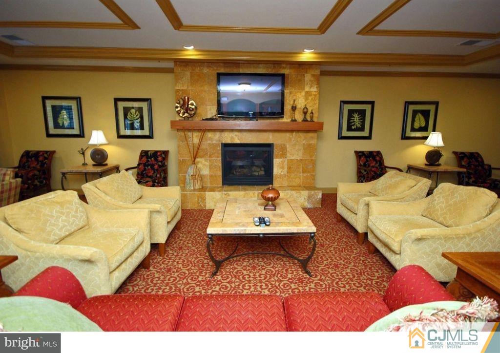100 Middlesex Boulevard Plainsboro, NJ 08536 - Photo 4 of 11 a living room with furniture and a fireplace