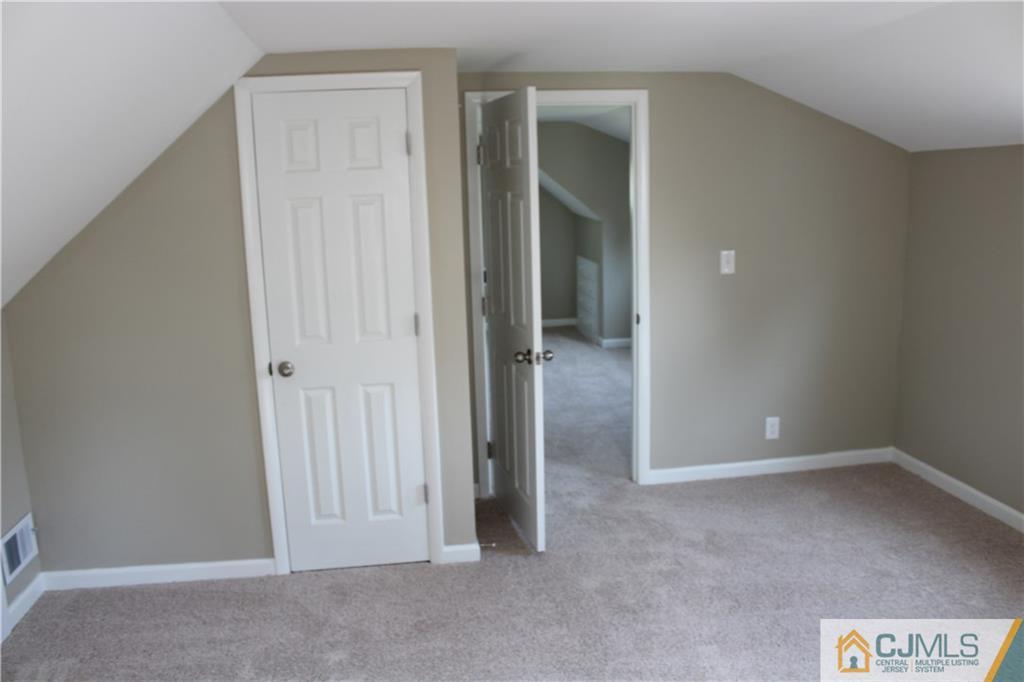 23 Roberts Road New Brunswick, NJ 08901 - Photo 14 of 22 an empty room with windows