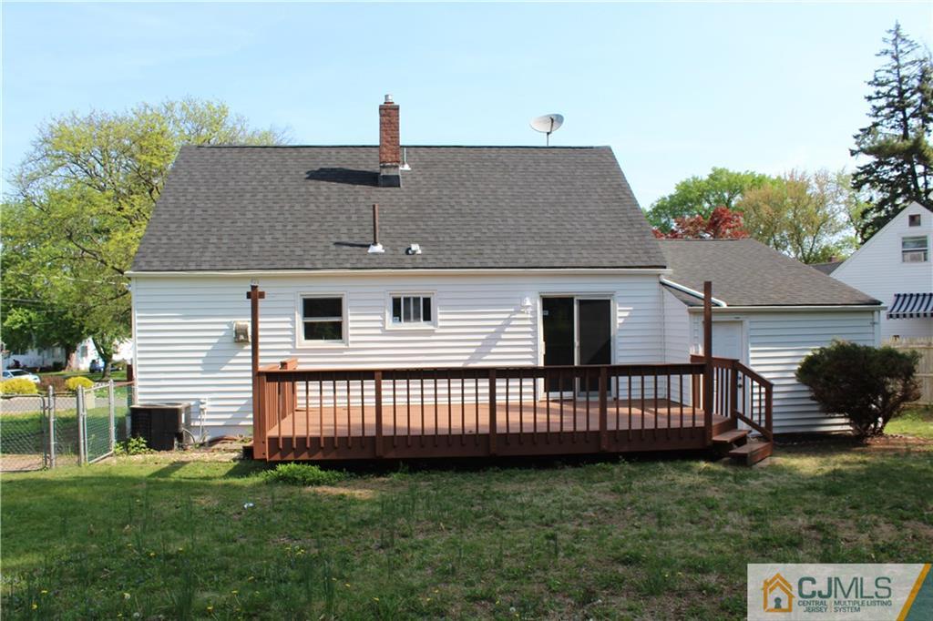 23 Roberts Road New Brunswick, NJ 08901 - Photo 3 of 22 a front view of a house with garden