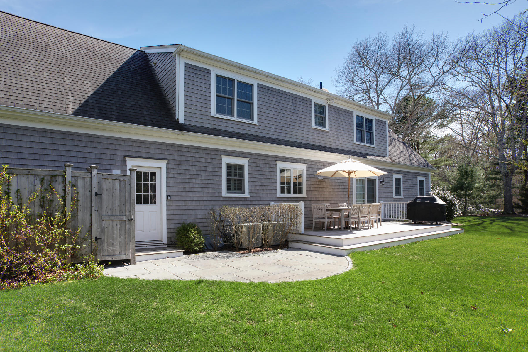 10 Barnard Road Osterville, MA 02655 - Photo 36 of 37 a front view of a house with a yard patio and fire pit