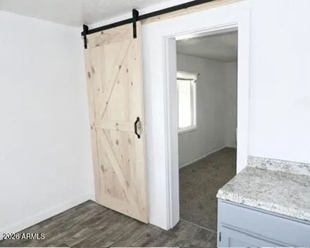 a view of bathroom with a granite countertop sink and shower