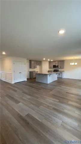 a view of kitchen and empty room