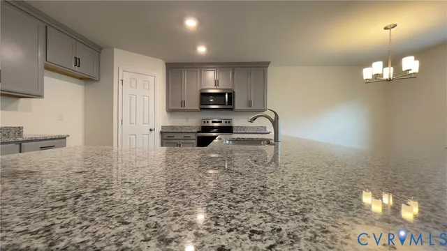 a kitchen with a stove refrigerator and cabinets