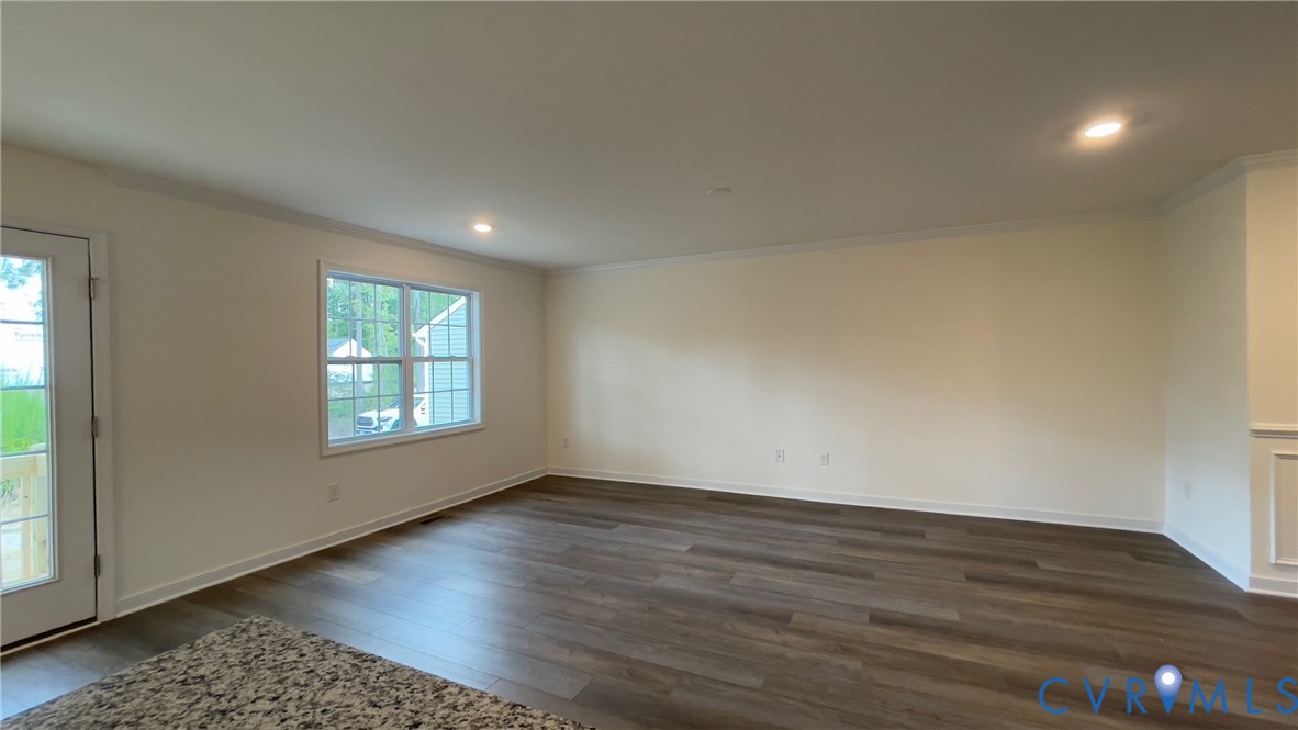 4944 Bailey Woods Lane Midlothian, VA 23112 - Photo 23 of 50 an empty room with wooden floor and windows