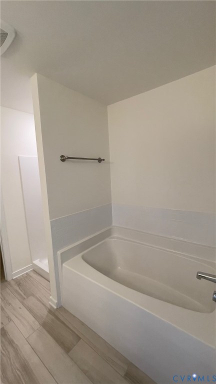 4944 Bailey Woods Lane Midlothian, VA 23112 - Photo 38 of 50 a white bath tub sitting next to a shower