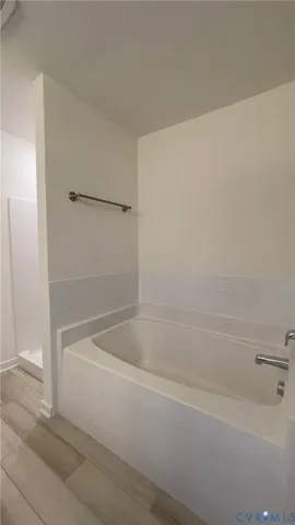 a bathroom with a granite countertop sink toilet and mirror