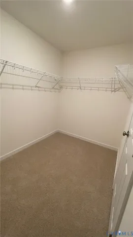 a view of an empty room and a window