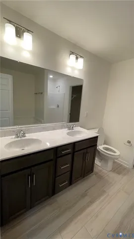 a bathroom with a sink and a large mirror