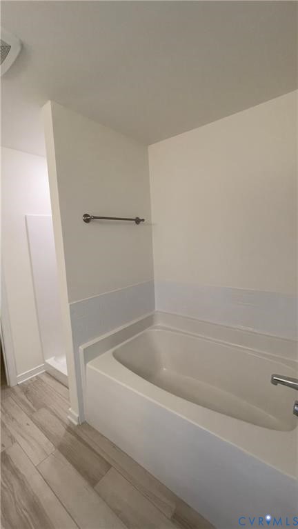 4944 Bailey Woods Lane Midlothian, VA 23112 - Photo 9 of 50 a white bath tub sitting next to a shower