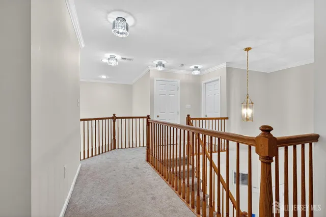 a view of a hallway with stairs