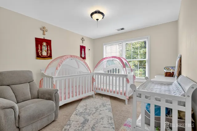 a view of a livingroom with furniture and windows