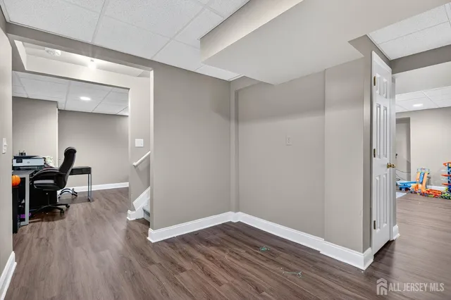 a workspace with furniture and wooden floor