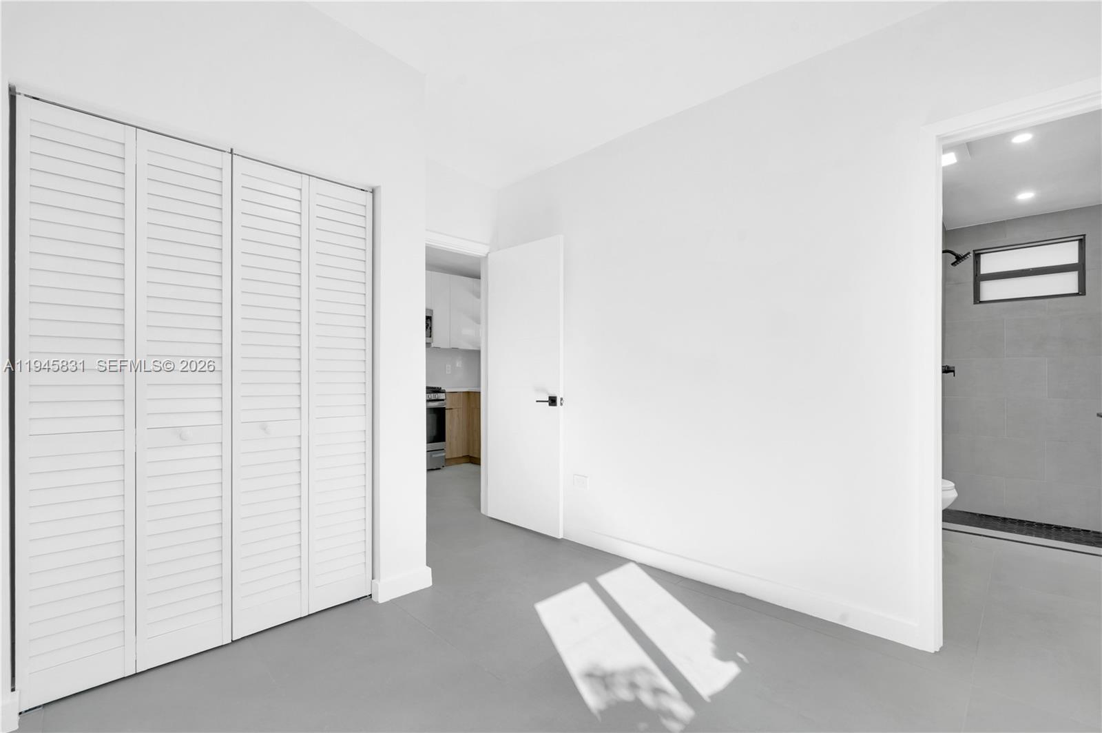 3040 Northwest 93rd Street, Unit D Miami, FL 33147 - Photo 4 of 8 a view of an empty room