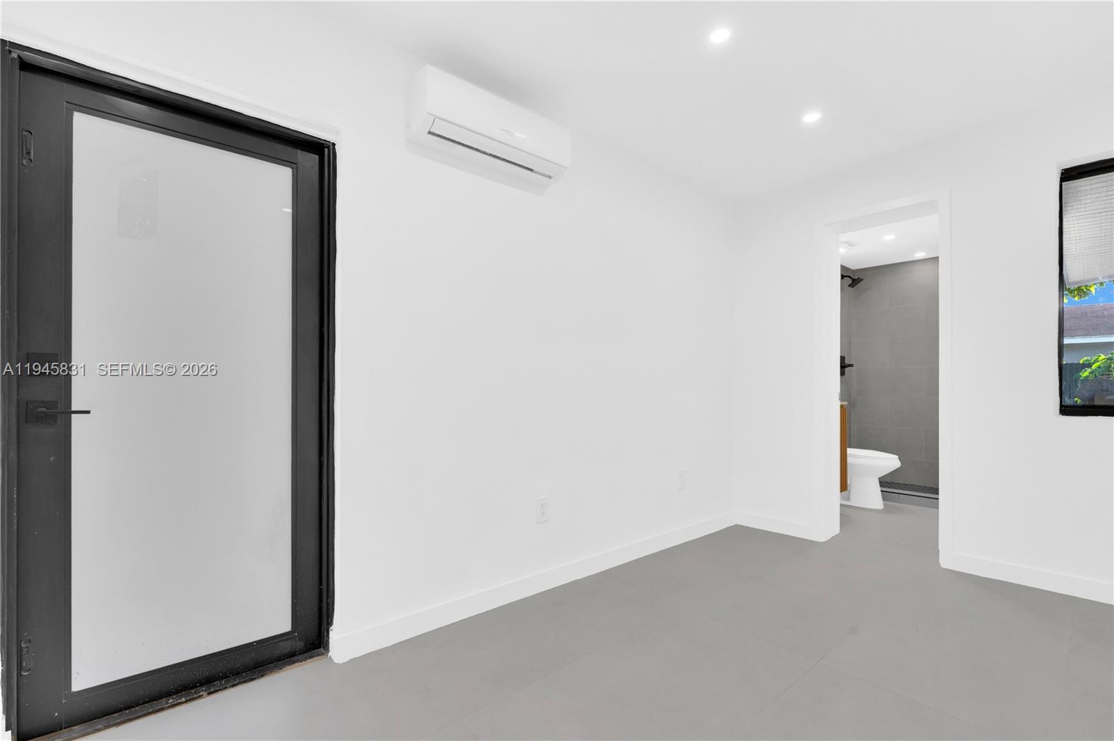 3040 Northwest 93rd Street, Unit D Miami, FL 33147 - Photo 6 of 8 a view of an empty room