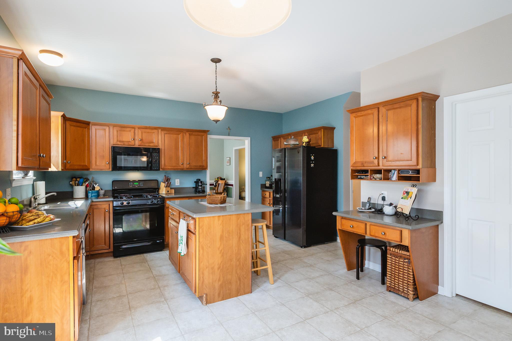 24 Eagleton Drive York, PA 17407 - Photo 19 of 70 a kitchen with stainless steel appliances granite countertop a refrigerator stove and sink