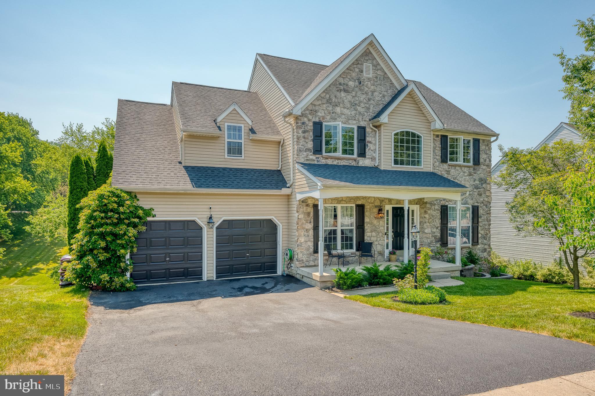 24 Eagleton Drive York, PA 17407 - Photo 2 of 70 a front view of a house with garden