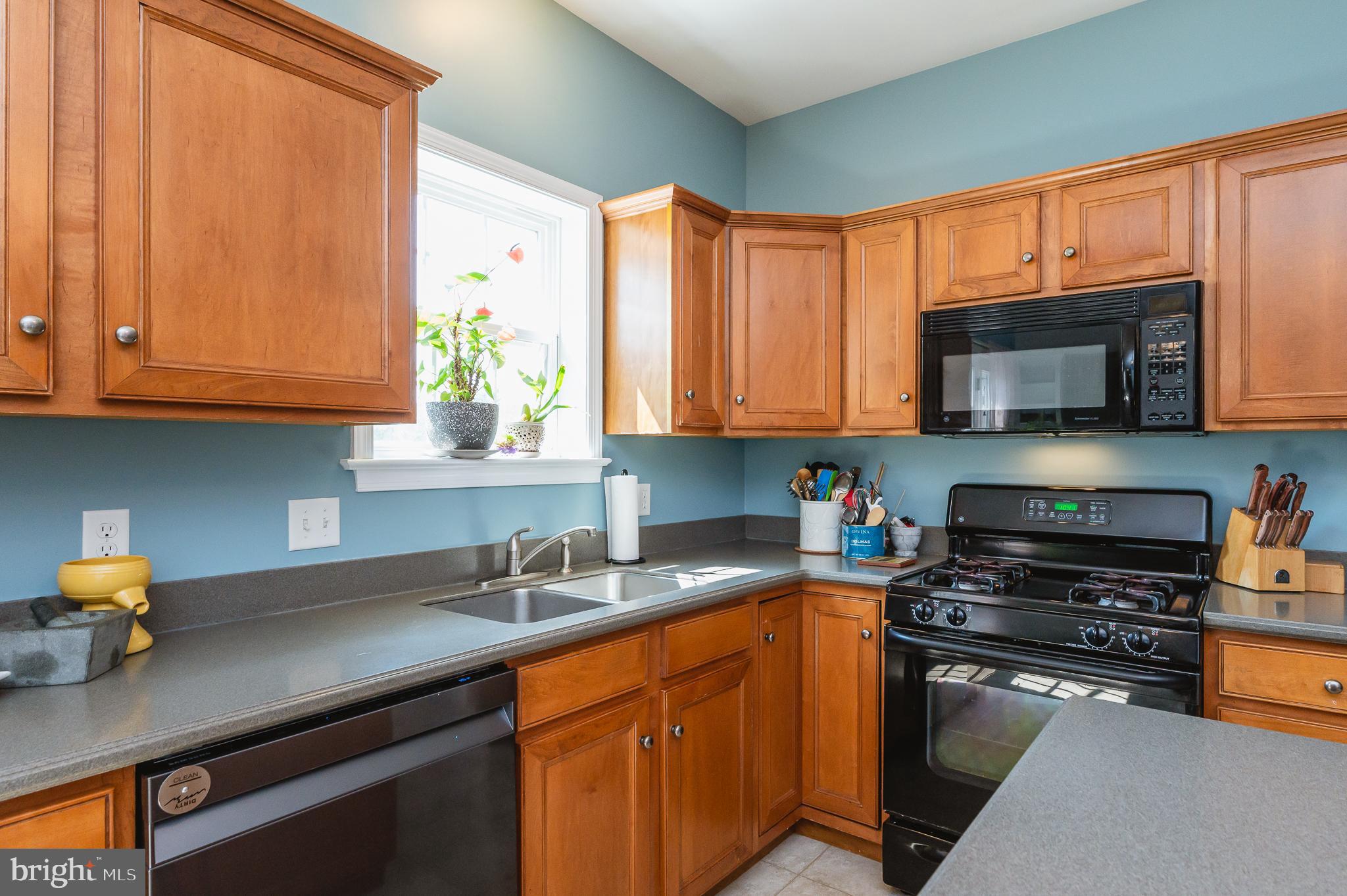 24 Eagleton Drive York, PA 17407 - Photo 21 of 70 a kitchen with stainless steel appliances granite countertop a sink stove and microwave