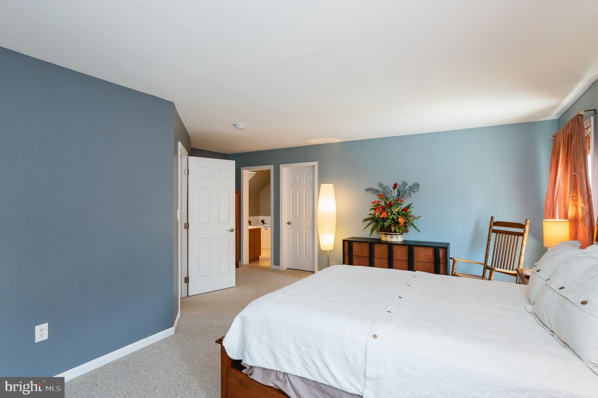 24 Eagleton Drive York, PA 17407 - Photo 30 of 70 a bedroom with a large bed a chandelier and a window