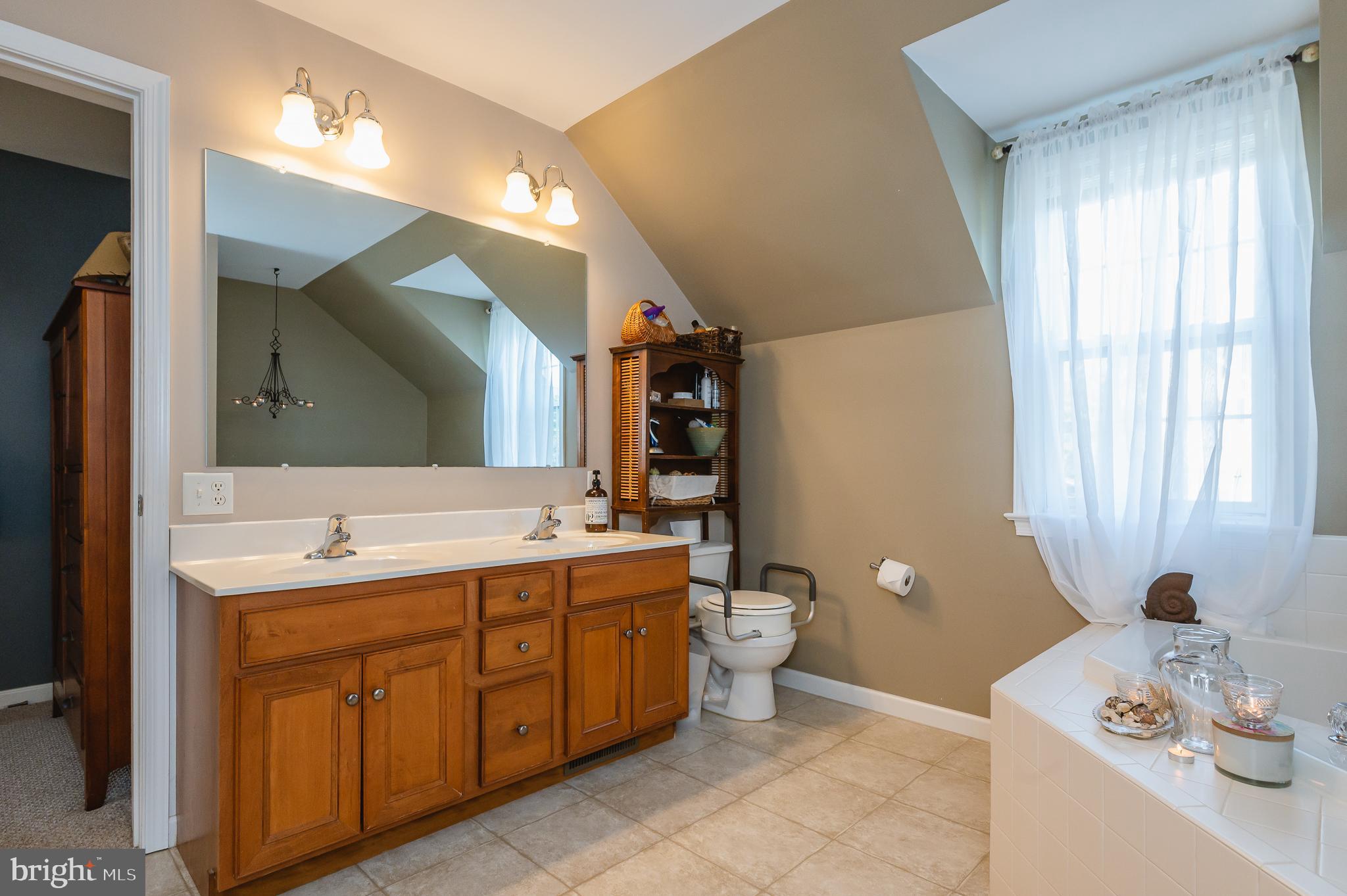 24 Eagleton Drive York, PA 17407 - Photo 33 of 70 a spacious bathroom with a double vanity sink toilet and a mirror