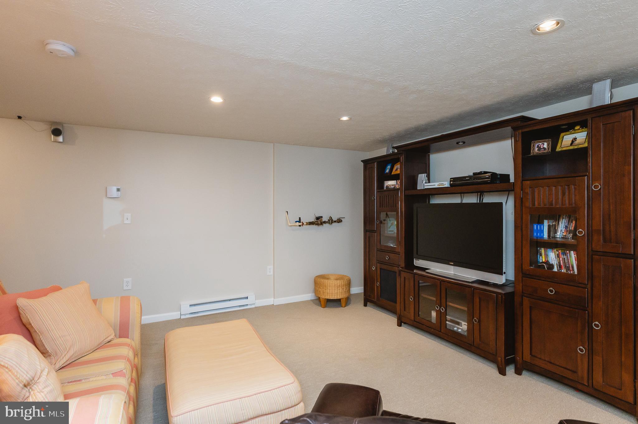 24 Eagleton Drive York, PA 17407 - Photo 50 of 70 a living room with furniture and a flat screen tv