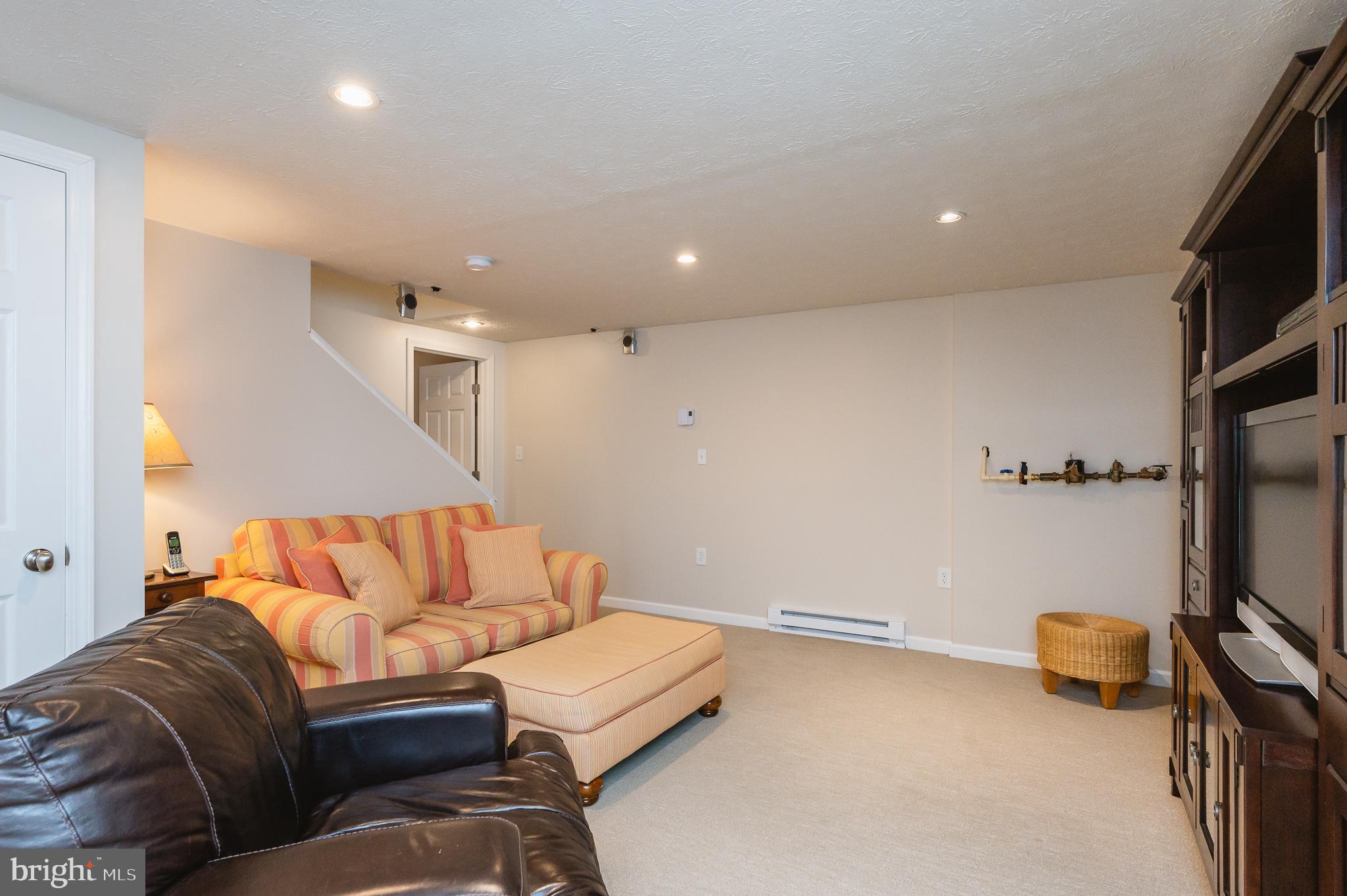 24 Eagleton Drive York, PA 17407 - Photo 51 of 70 a living room with furniture and a flat screen tv