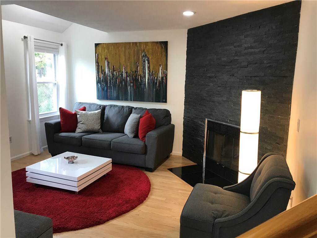 17 Spring Street, Unit B2 Pawtucket, RI 02860 - Photo 8 of 40 Light-Filled Living Room w/Gas Fireplace...