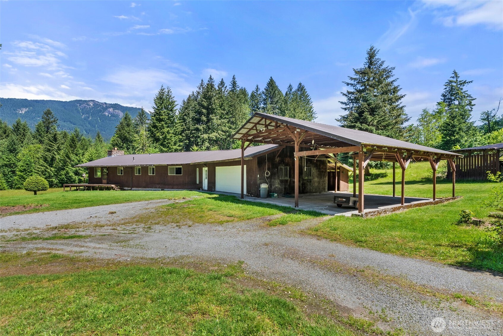 155 Bonell Road Randle, WA 98377 - Photo 4 of 38 a view of a house with a yard and a garden
