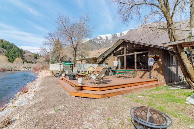 3711 North Canyon Road Provo, UT 84604 - Photo 40 of 42 Deck with a fire pit and a water and mountain view