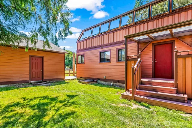 a front view of a house with a yard