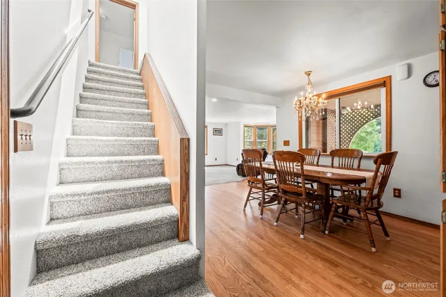 a view of a dining room with furniture and wooden floor