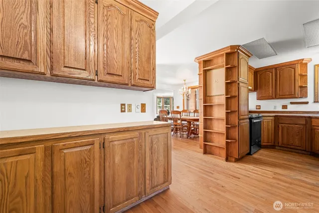 a kitchen with stainless steel appliances a refrigerator and cabinets