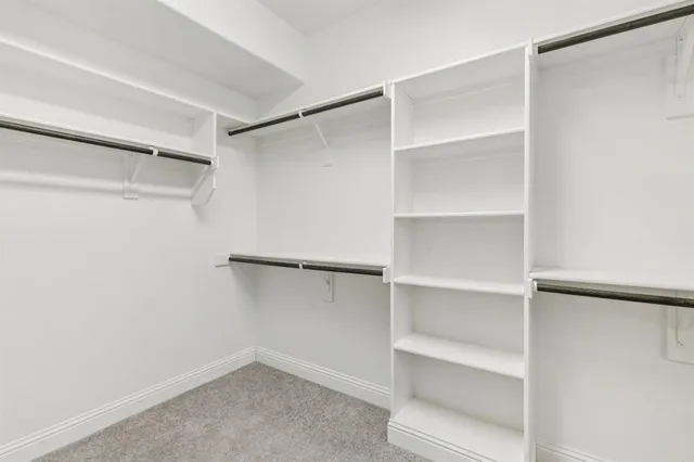 a view of an empty walk in closet