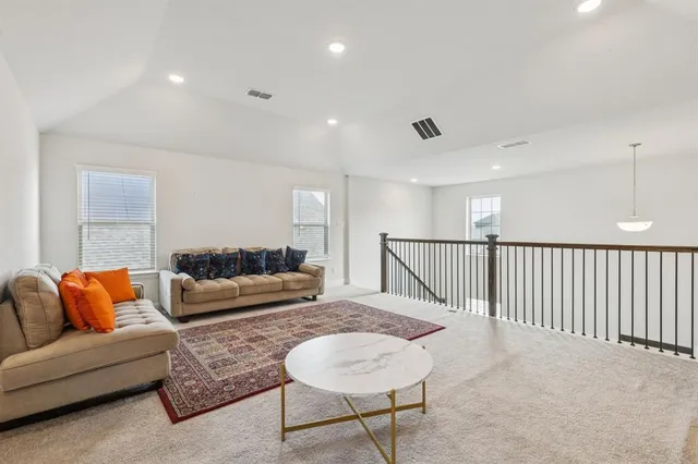 a living room with furniture and a couch
