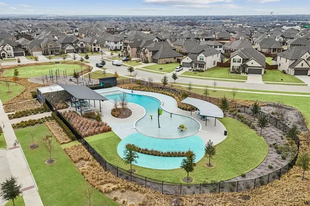 an aerial view of a house with outdoor space