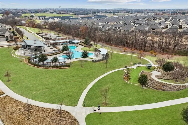 an aerial view of a house with a big yard