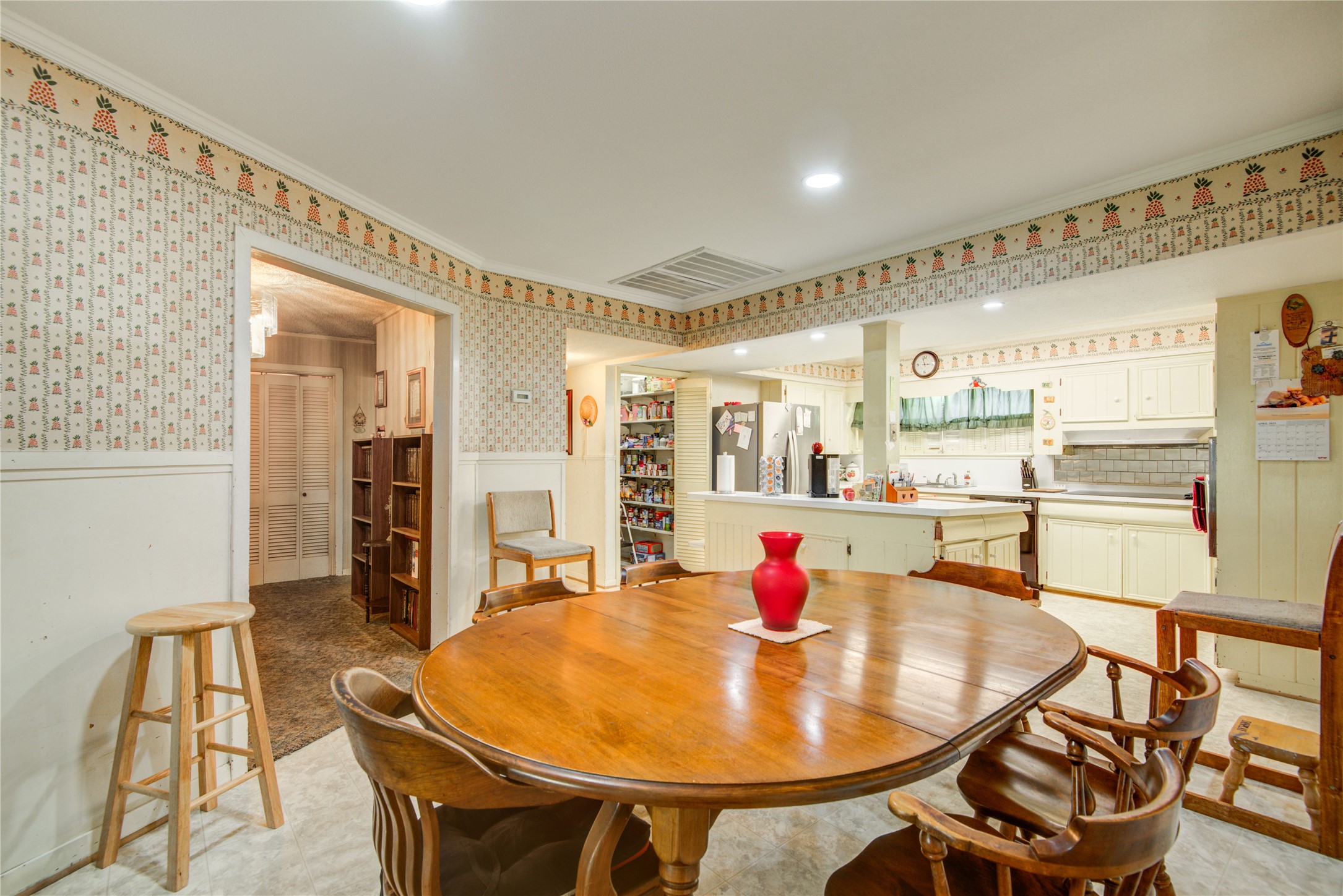 1414 West 9th Street Freeport, TX 77541 - Photo 13 of 50 a living room with dining table and chairs