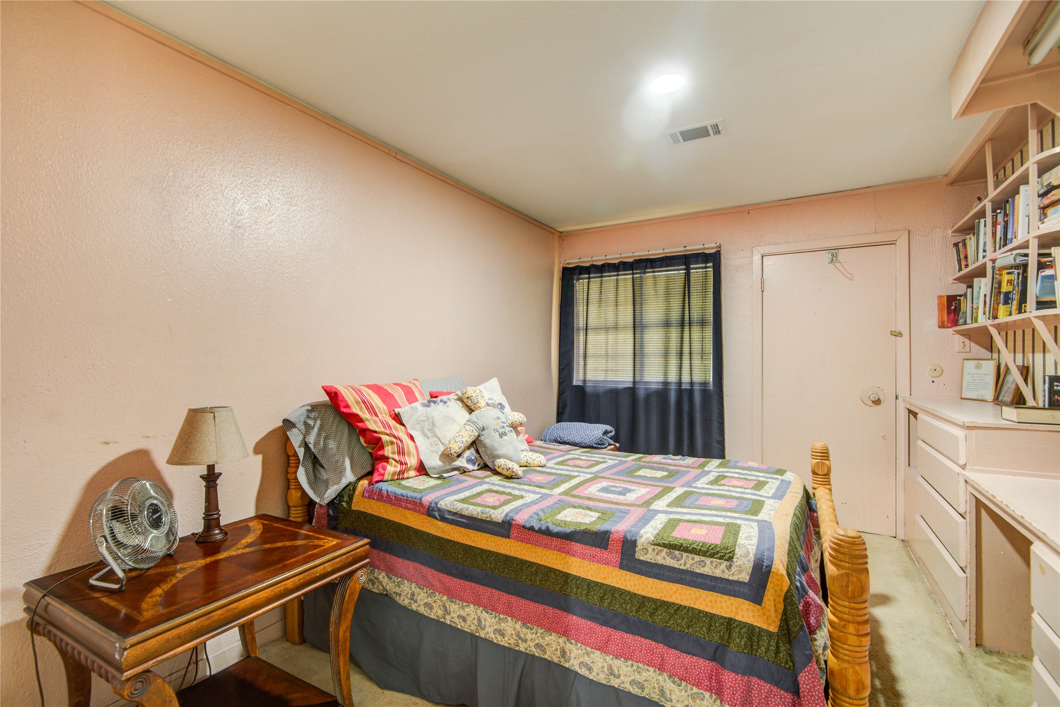1414 West 9th Street Freeport, TX 77541 - Photo 27 of 50 a bedroom with a bed and a window