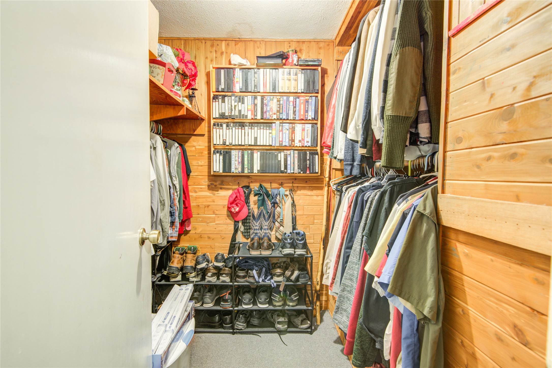 1414 West 9th Street Freeport, TX 77541 - Photo 29 of 50 a view of walk in closet with clothes and shoes